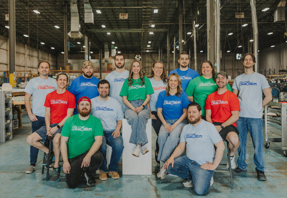 Group shot of several Bluecotton employees